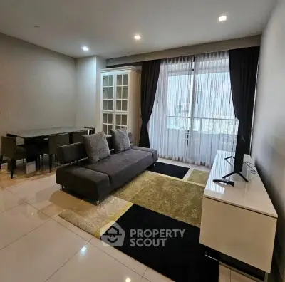 Modern living room with sleek furniture and large window for natural light