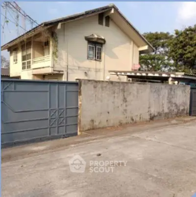 Charming two-story house with gated entrance and spacious driveway