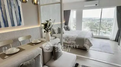 Modern open-plan living room and bedroom with panoramic city view