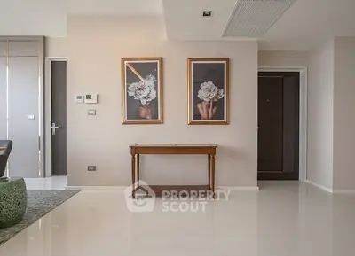 Elegant interior with modern decor and framed art in a spacious living area.