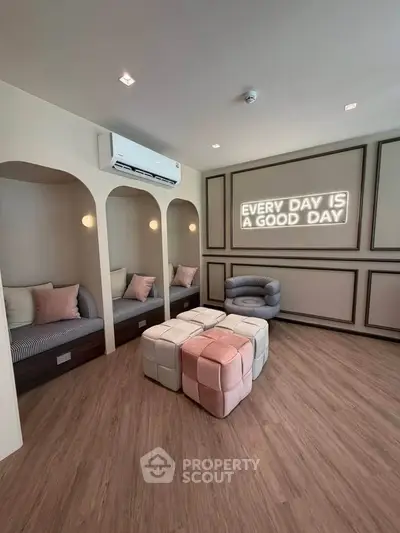 Stylish living room with cozy seating and inspirational wall art, perfect for relaxation and comfort.