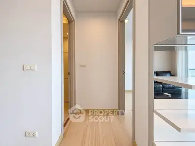Modern apartment hallway with sleek design and wooden flooring