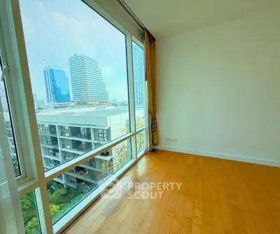Spacious corner unit with floor-to-ceiling windows offering a stunning city view.