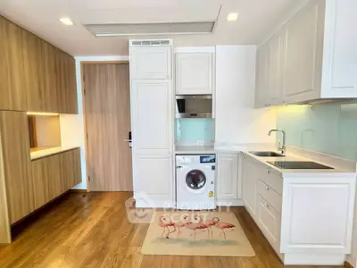 Modern kitchen with integrated washing machine and sleek cabinetry