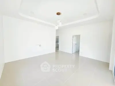 Spacious empty room with modern lighting and glossy tiled floor, perfect for customization.