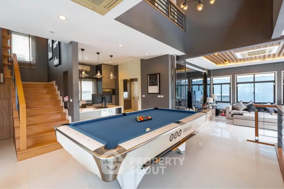 Luxurious living room with pool table and modern decor