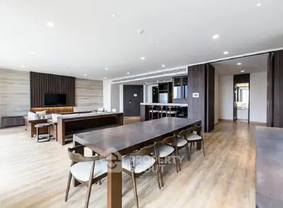 Spacious modern living room with open layout and elegant wooden furniture