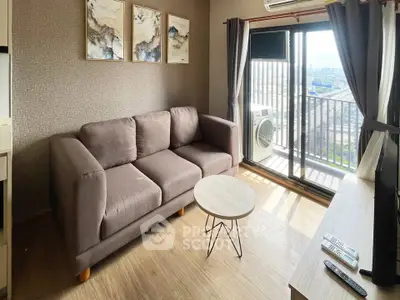 Modern living room with cozy sofa and balcony view in a stylish apartment.
