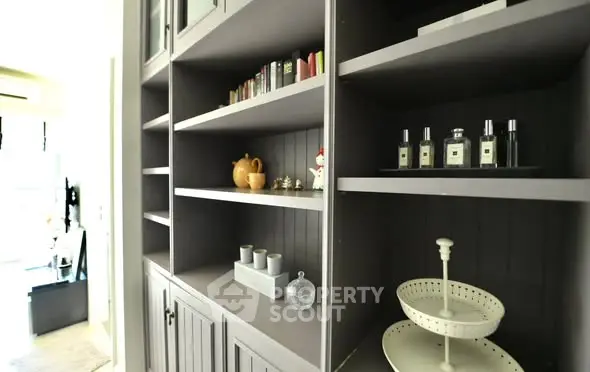 Elegant built-in shelving with decorative items in a modern home interior