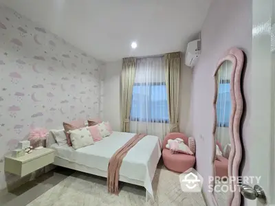 Charming bedroom with pastel decor and cozy ambiance, featuring stylish furniture and elegant curtains.