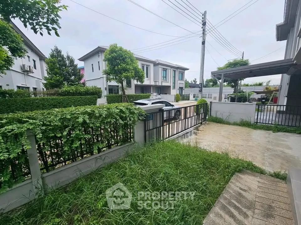 Charming suburban home with lush greenery and modern architecture in a peaceful neighborhood.