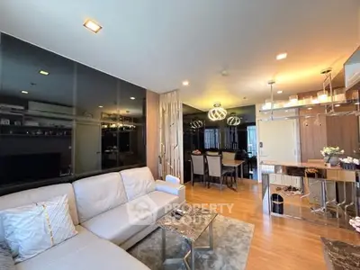 Modern living room with elegant decor and open dining area