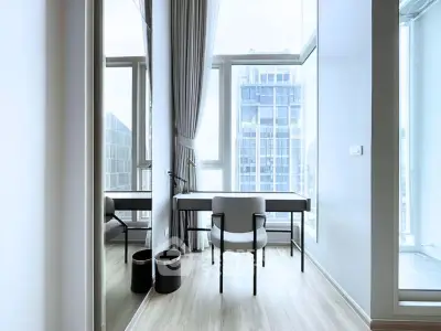 Modern study room with floor-to-ceiling windows and city view