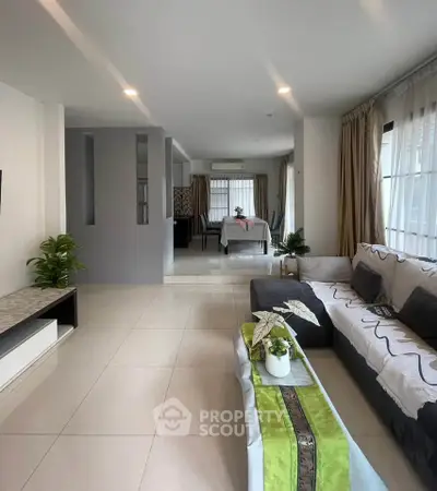 Spacious modern living room with elegant decor and natural light