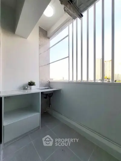 Modern balcony with sleek design and city view, perfect for relaxation.