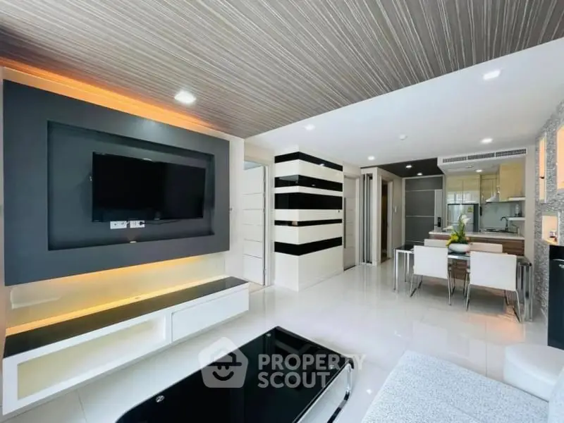 Modern living room with sleek design and open kitchen layout