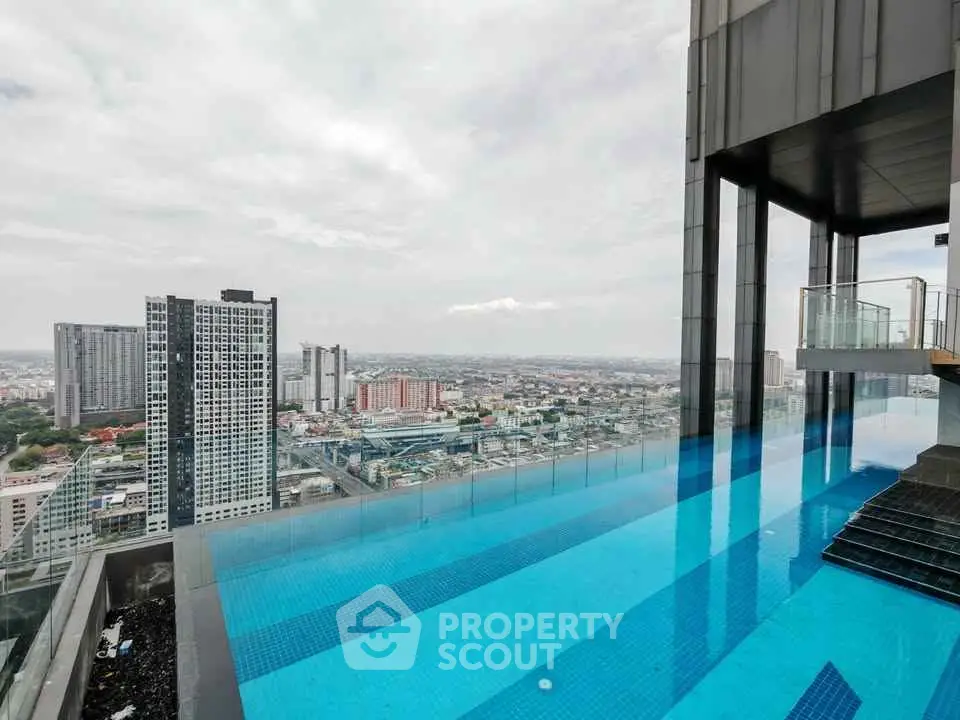 Stunning rooftop infinity pool with breathtaking city skyline view