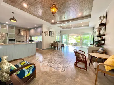 Spacious open-layout living room with stylish decor and natural light