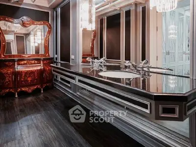 Luxurious bathroom with elegant vanity and chandelier lighting