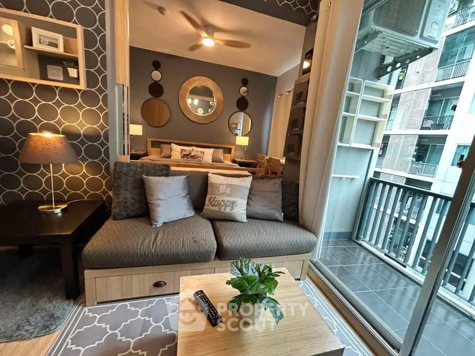 Modern living room with stylish decor and balcony view in urban apartment