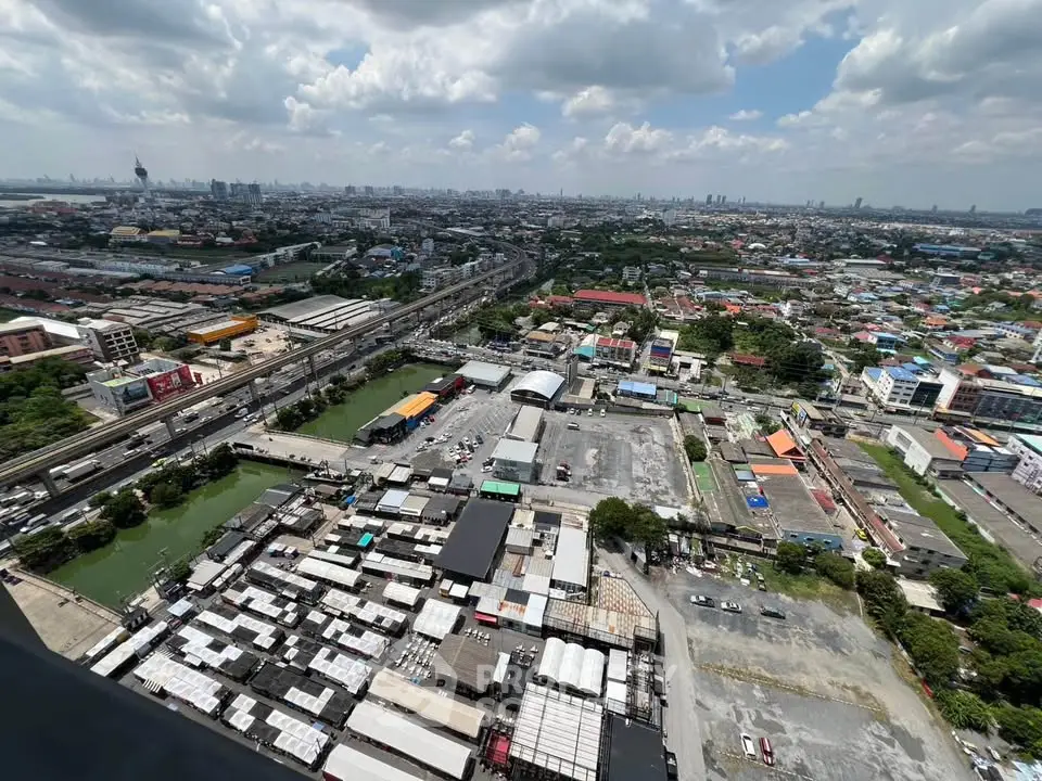 Stunning aerial view of urban landscape with sprawling cityscape and vibrant skyline, perfect for real estate investment.