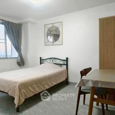 Cozy bedroom with modern decor and natural light