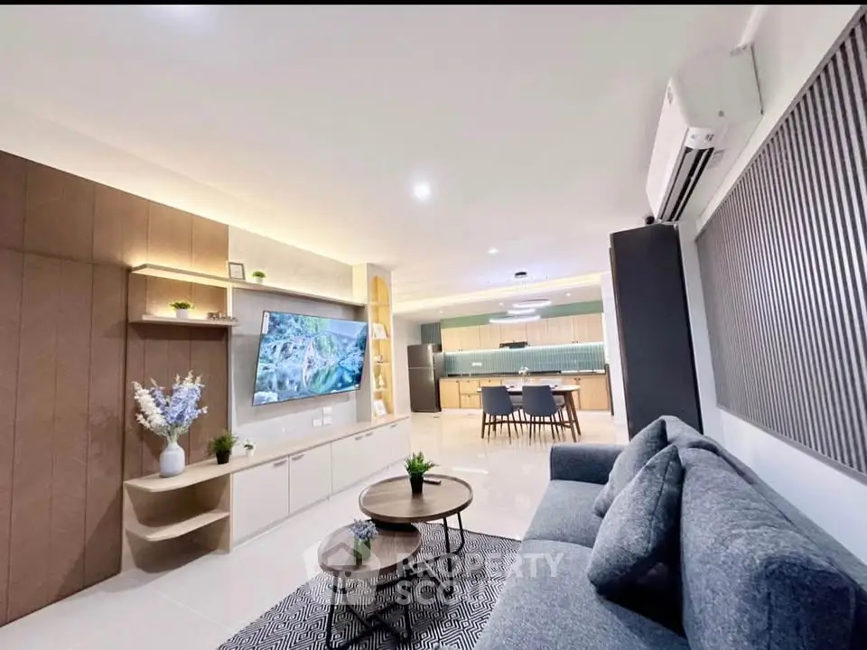Modern living room with stylish decor and open kitchen layout