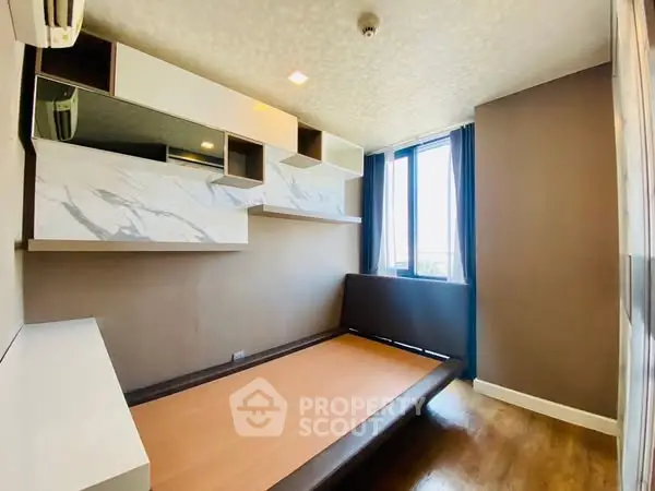 Modern bedroom with built-in storage and large window view