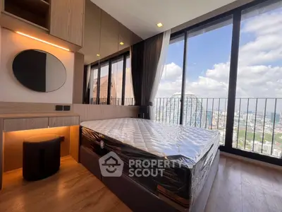 Luxurious bedroom with stunning city view and modern furnishings