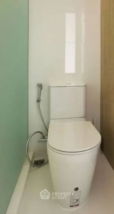 Modern minimalist bathroom with sleek toilet design and neutral colors