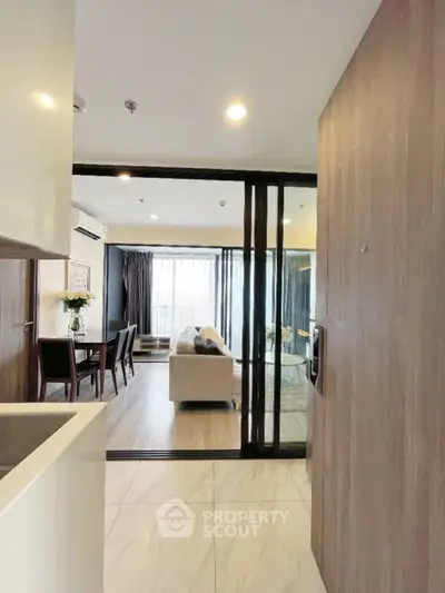 Modern open-plan living room with stylish decor and natural light