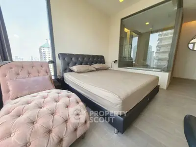 Luxurious bedroom with city view and elegant furnishings in modern apartment