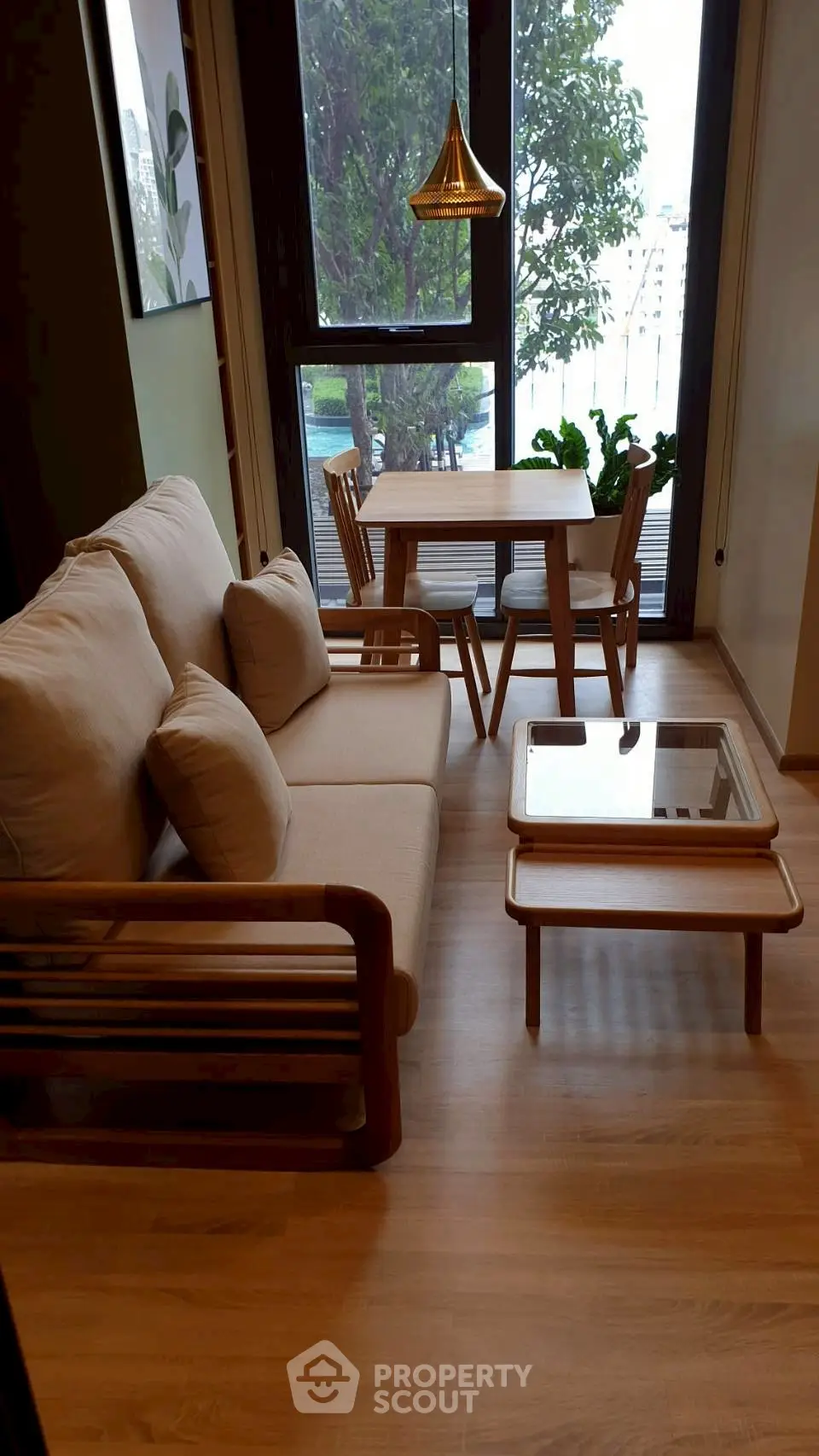 Chic modern living room with wooden furniture and large window view.