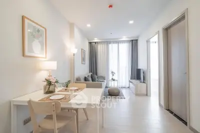 Bright and modern living room with dining area in a stylish apartment