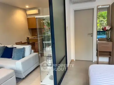 Modern open-plan living room with cozy seating and stylish decor