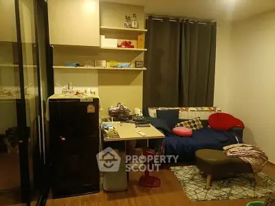 Cozy living room with modern decor and compact furniture setup