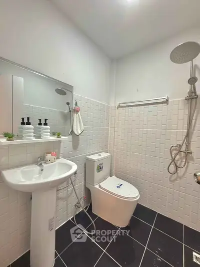 Modern bathroom with sleek fixtures and white tile design
