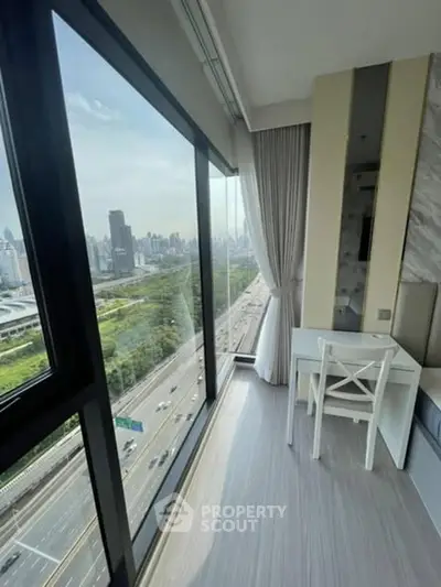 Stunning high-rise apartment with panoramic city view and modern interior design.
