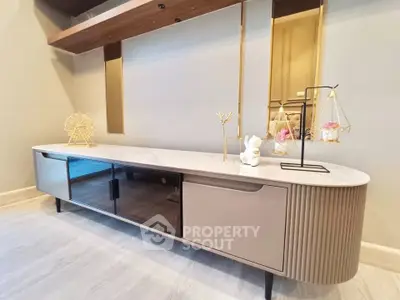 Stylish modern living room with elegant TV console and decorative accents