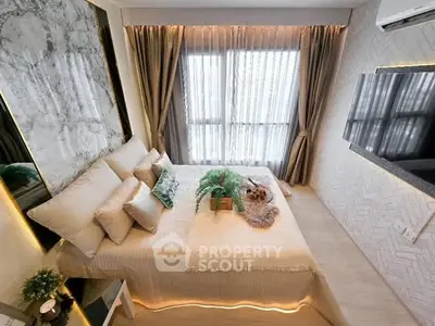 Luxurious bedroom with elegant decor and large window for natural light