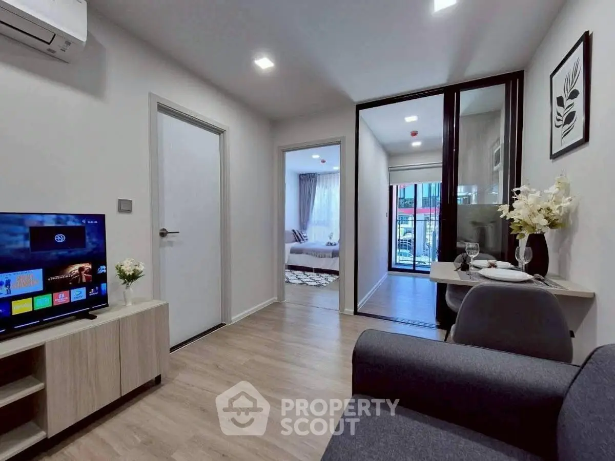 Modern living room with sleek design, open layout, and stylish decor in a contemporary apartment.