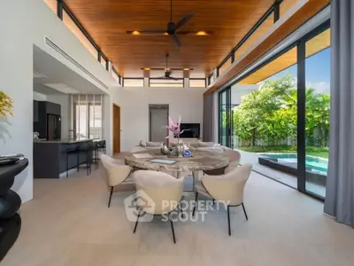 Luxurious open-plan living room with pool view and modern decor