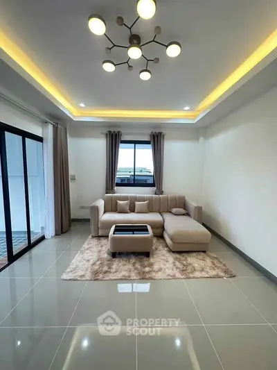 Modern living room with stylish lighting and cozy beige sofa