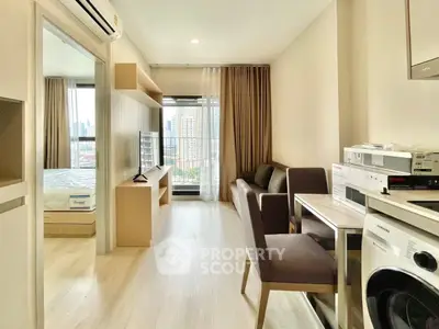 Modern apartment interior with open layout, featuring a cozy living area, dining space, and bedroom view.