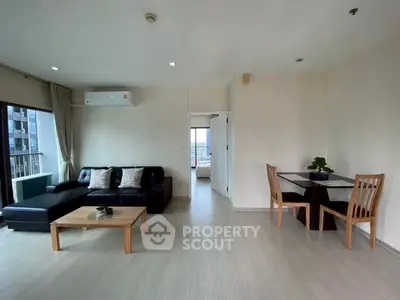 Spacious modern living room with open layout and city view