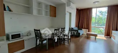 Spacious living room with modern furniture and large window view