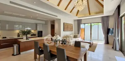 Luxurious open-plan living room with modern kitchen and elegant chandelier