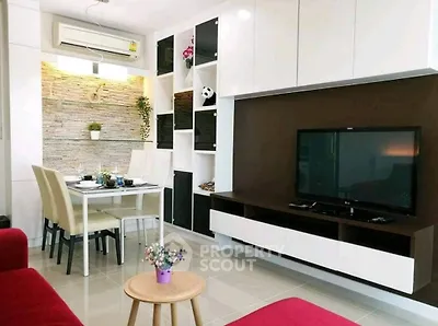 Modern living room with stylish furniture and built-in TV unit, perfect for cozy family gatherings.