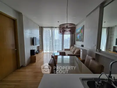 Modern living room with city view, stylish furniture, and natural light