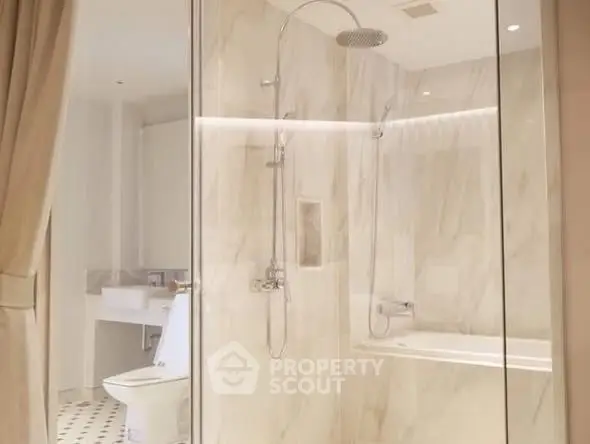 Luxurious bathroom with elegant marble shower and modern fixtures